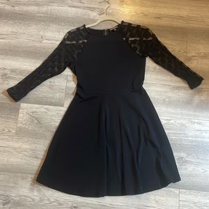 Black express dress with polka dot mesh arm sleeves